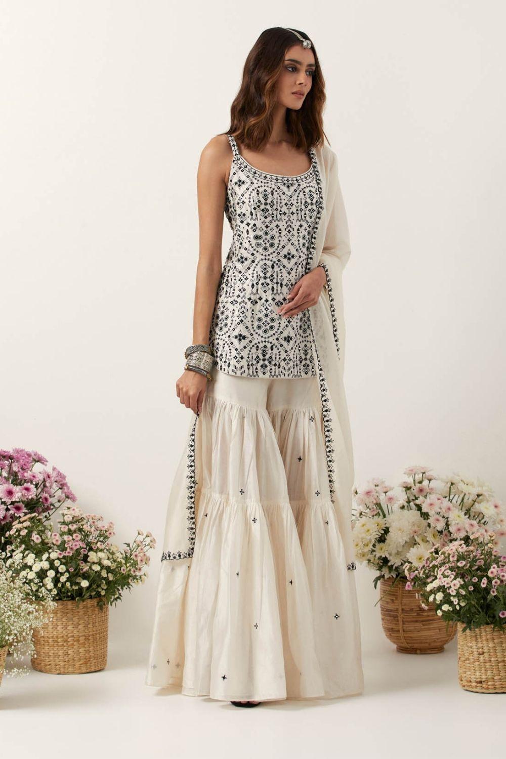 Ivory Strappy Short Kurti Paired With Gharara & Dupatta