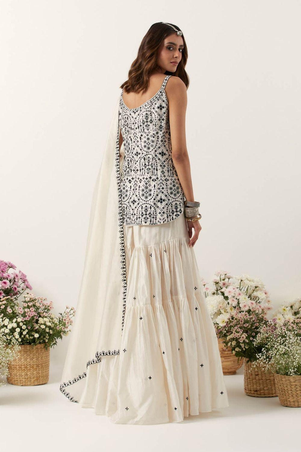 Ivory Strappy Short Kurti Paired With Gharara & Dupatta